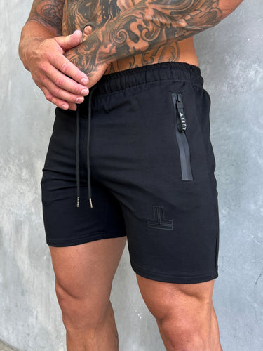 End Fit Tapered Shorts in black on black by Lift The Label, close up showing zip pockets and drawstring