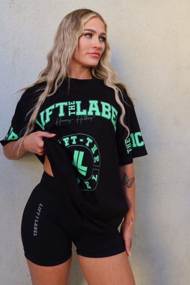 Prints Tee in black and lime green by Lift The Label, front view on female model